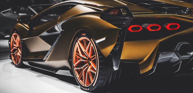 Which entrepreneur made tractors before entering the sports car business?